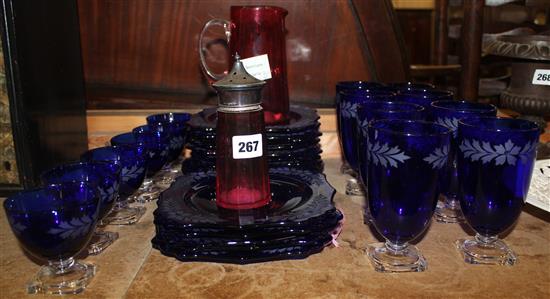 Blue glass table suite, cranberry glass jug, sugar sifter